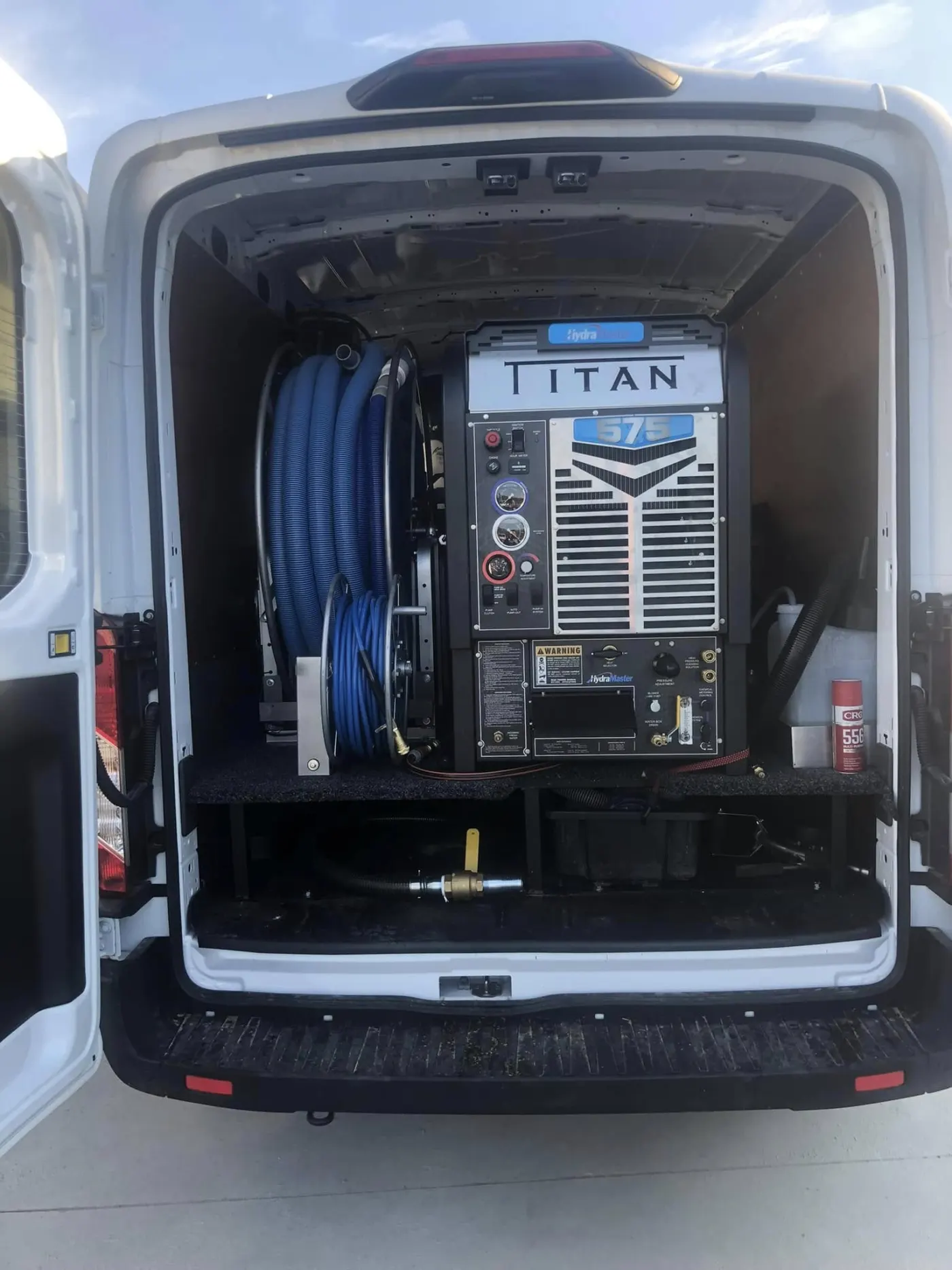 Van-mounted hot water extraction equipment inside the service vehicle