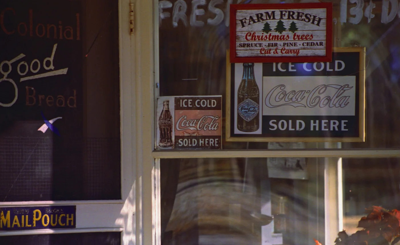 Shopfront window with signs and glass panels